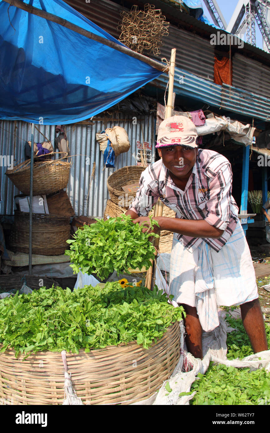 Vegetable seller selling leaf vegetable, Kolkata, West Bengal, India