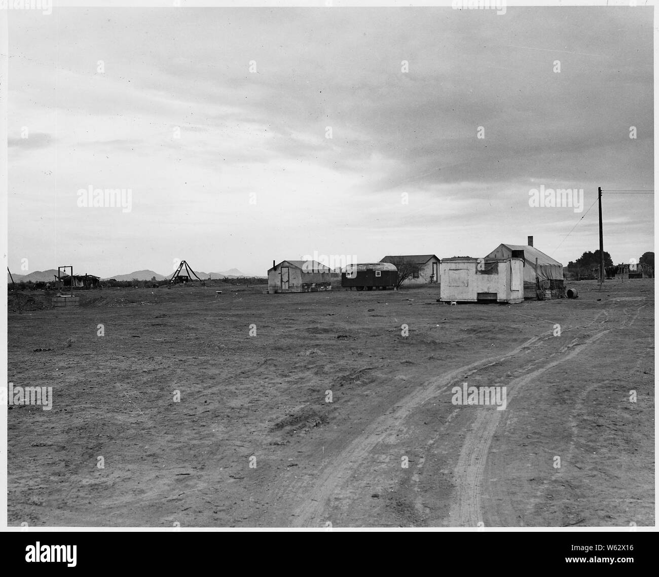 Cashion, Maricopa County, Arizona. Self-resettlement by Southwestern whites on 100 acre subdivision. . . .; Scope and content:  Full caption reads as follows: Cashion, Maricopa County, Arizona. Self-resettlement by Southwestern whites on 100 acre subdivision. Water from well dug by hand, with rope and bucket hoists. Terms $50 down. Stock Photo