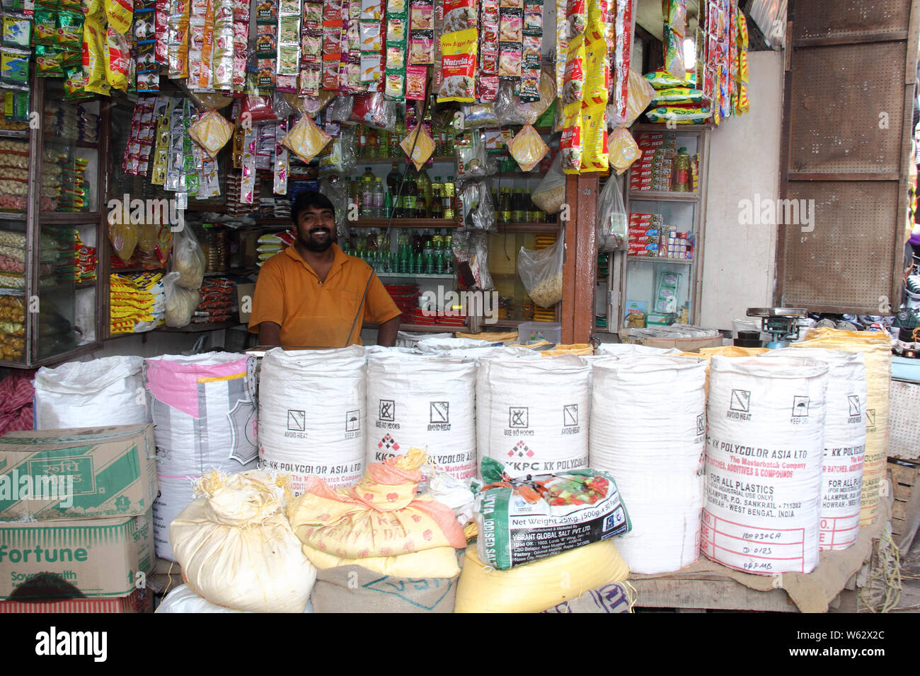 Shopkeeper in grocery shop Stock Photo - Alamy