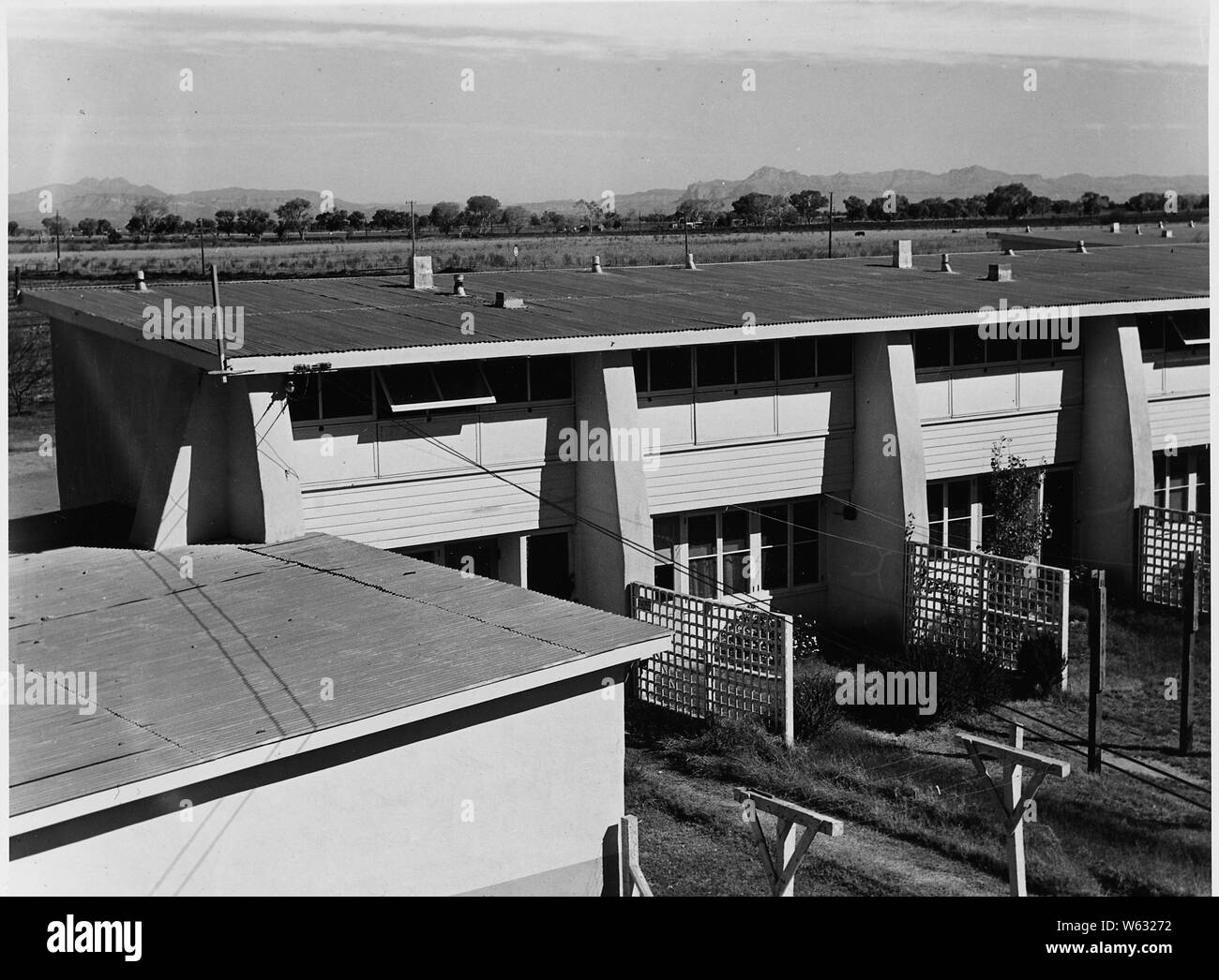 Chandler, Maricopa County, Arizona. One unit of agricultural labor housing. FSA cooperative part-tim . . .; Scope and content:  Full caption reads as follows: Chandler, Maricopa County, Arizona. One unit of agricultural labor housing. FSA cooperative part-time farm after three years of occupancy. There are four units, each with 8 apartments. Rentals $9. to $13. per month plus $6. for utilities. Operated in conjunction with 300-acre dairy farm. Stock Photo