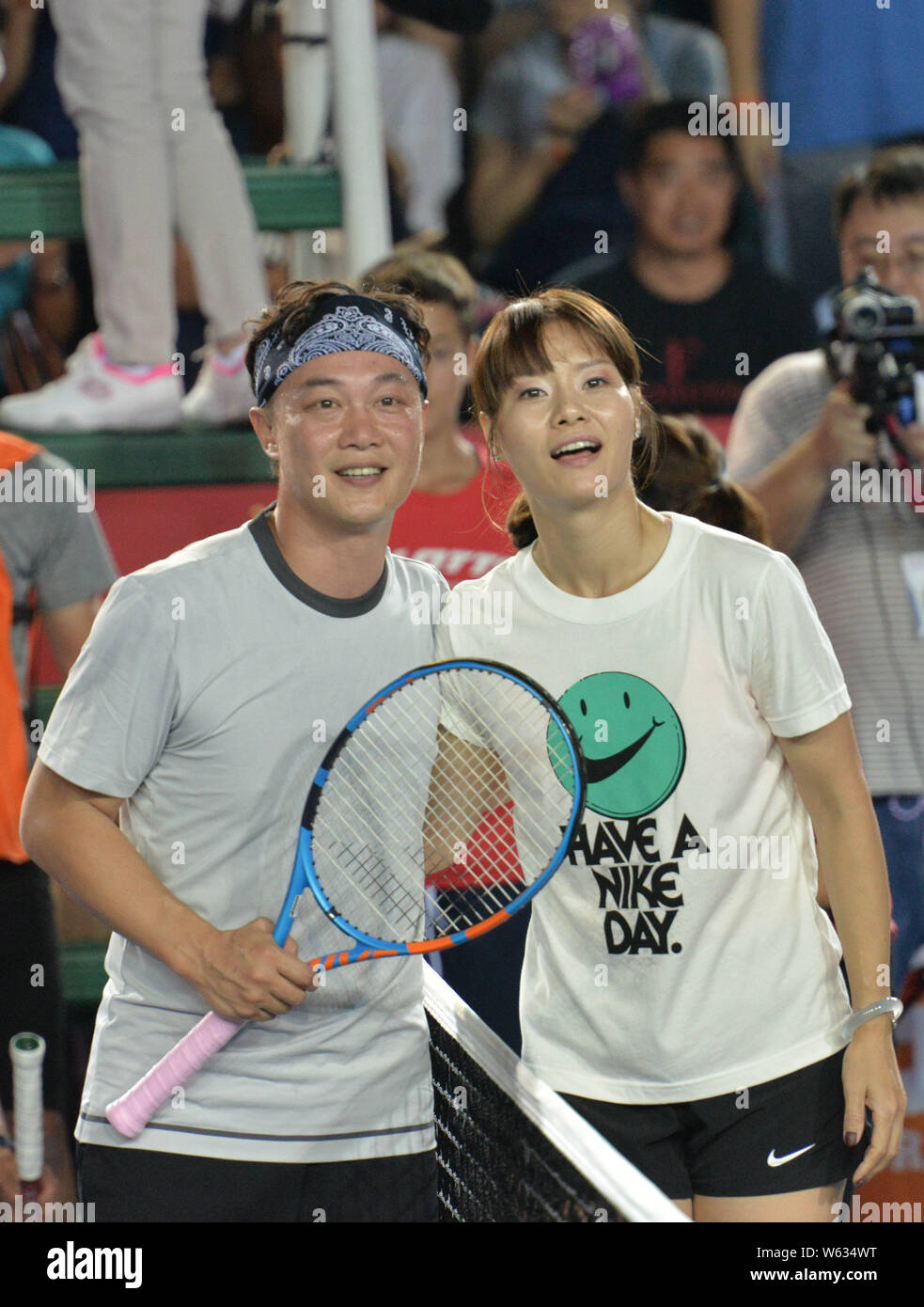 Retired Chinese tennis star Li Na, right, and Hong Kong singer Eason Chan are pictured at a celebrity exhibition match during the WTA Hong Kong Tennis Stock Photo
