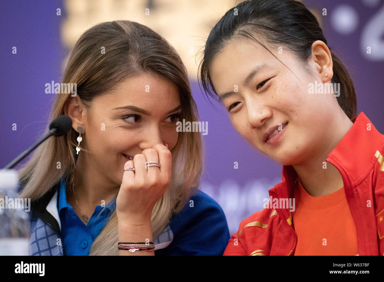 Romanian table tennis player Bernadette Szocs, left, and Chinese table