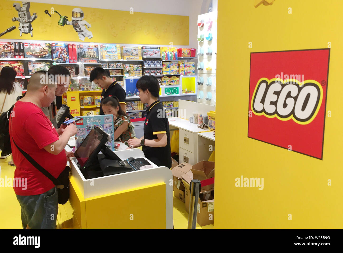 Chinese customers shop at a Lego store in Wuhan city, central China's Hubei province, 31 August 2018.   Toymaker The Lego Group said it plans to accel Stock Photo