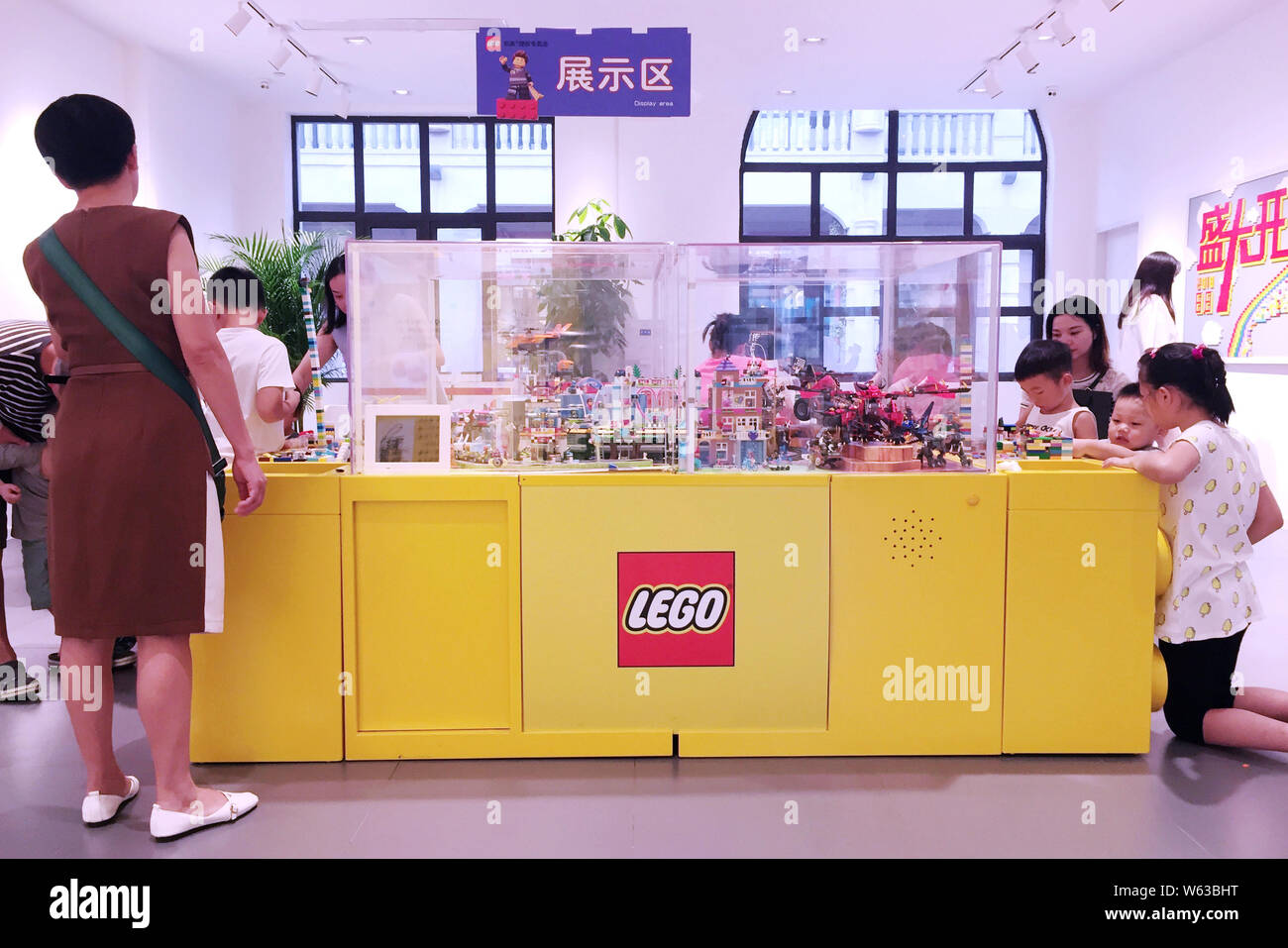 Chinese customers shop at a Lego store in Wuhan city, central China's Hubei province, 31 August 2018.   Toymaker The Lego Group said it plans to accel Stock Photo