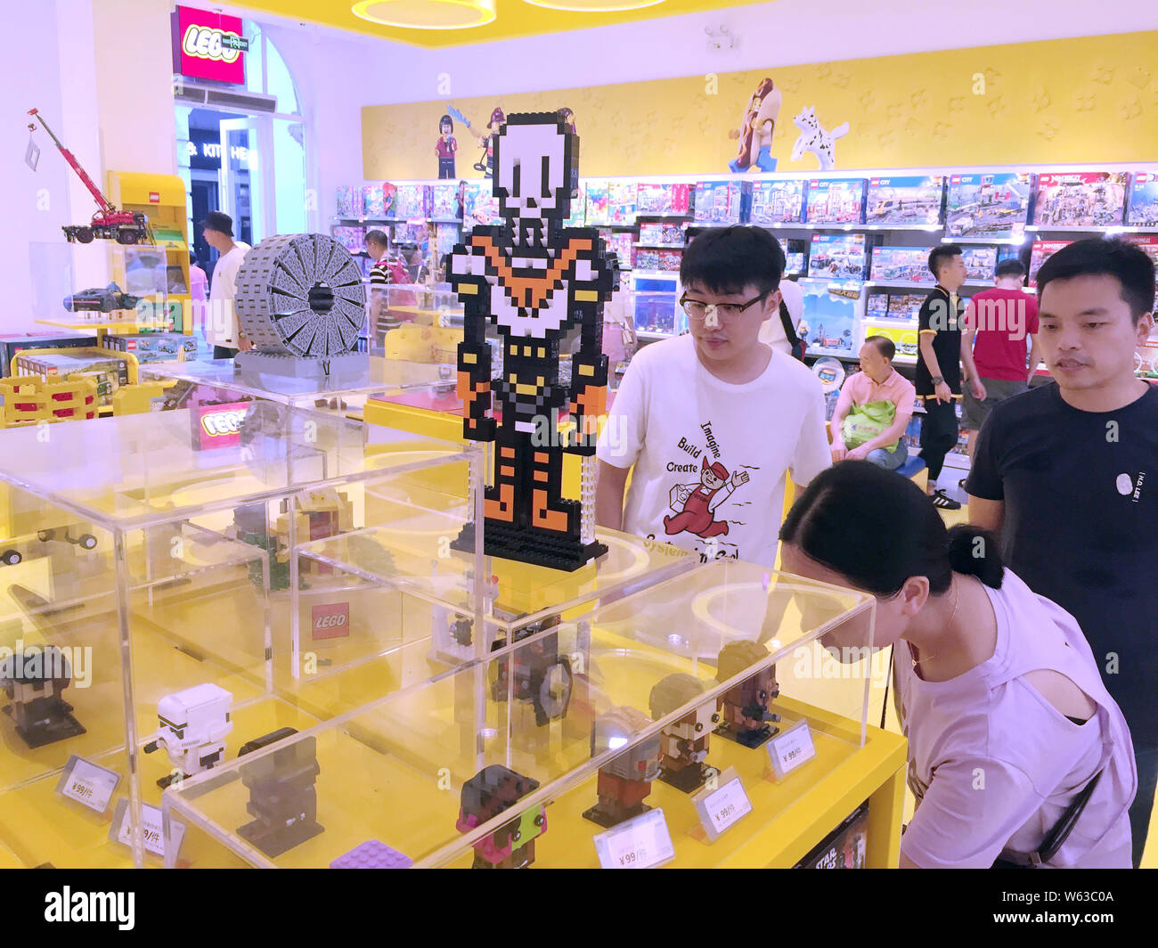 Chinese customers shop at a Lego store in Wuhan city, central China's Hubei province, 31 August 2018.   Toymaker The Lego Group said it plans to accel Stock Photo