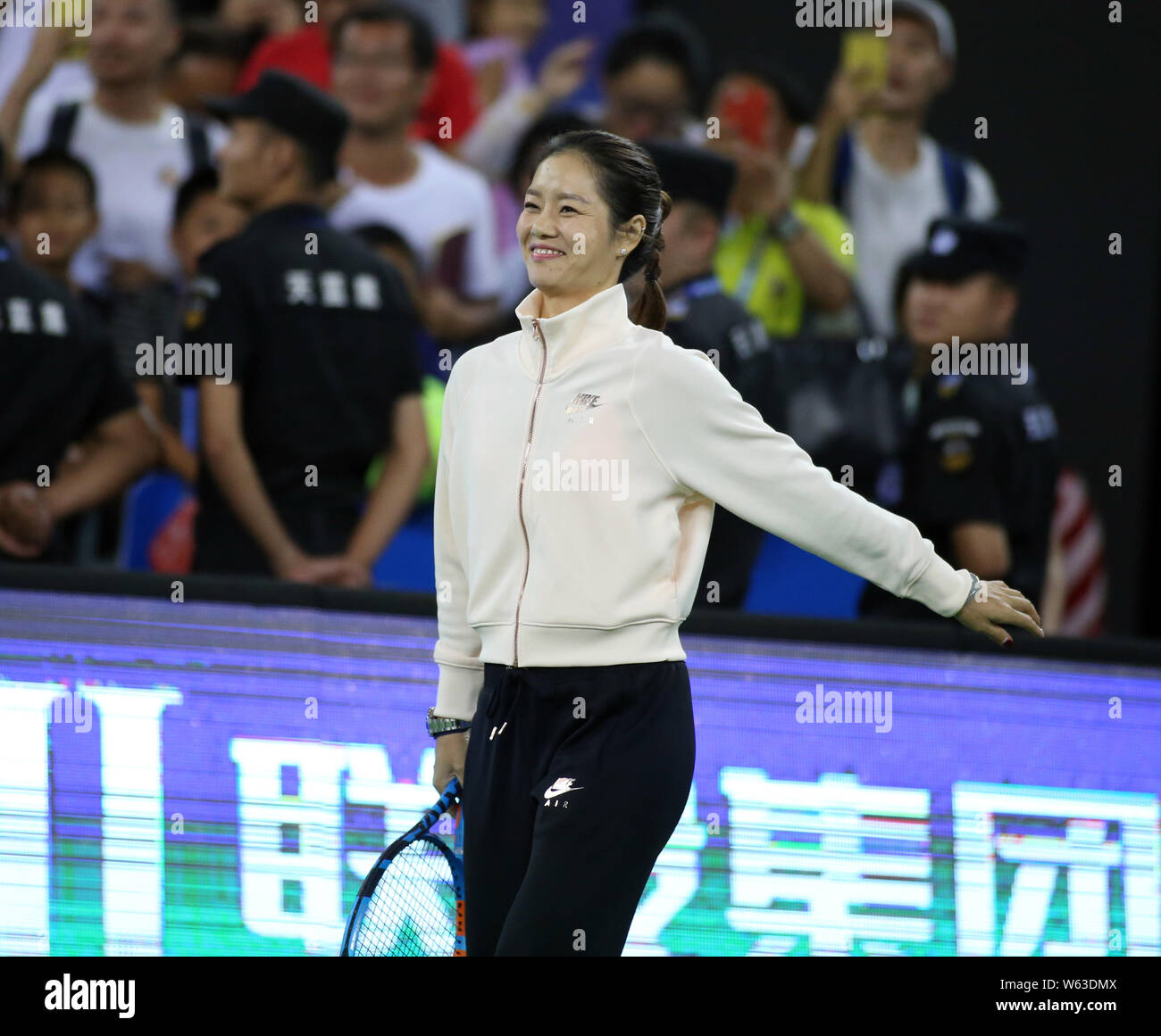 Retired Chinese tennis star Li Na is pictured at a first round match