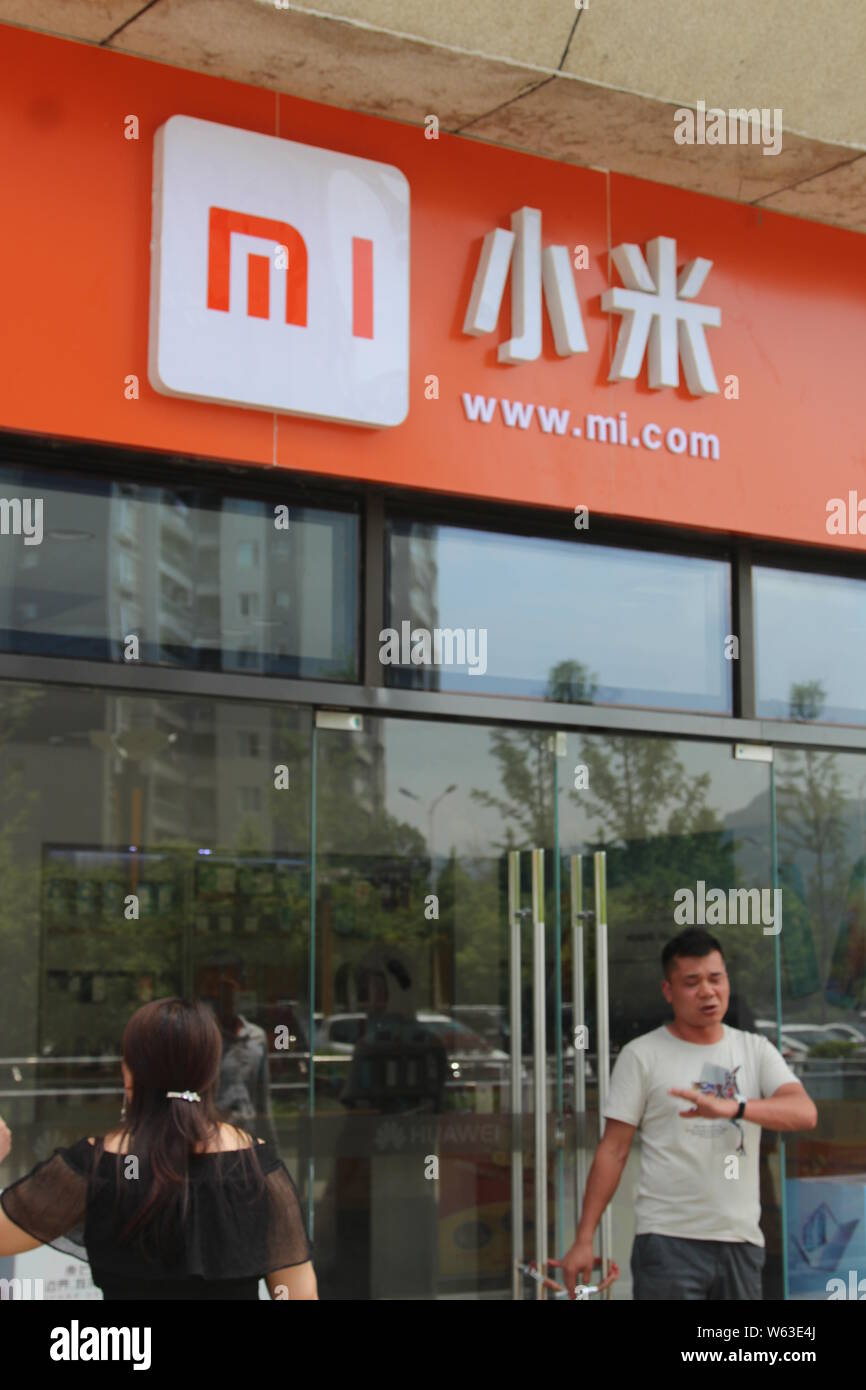 FILE Pedestrians walk past a store of Xiaomi in Chongqing China 24 May 2018. Xiaomi backed wearable brand Huami Technology on Monday launched Stock Photo Alamy