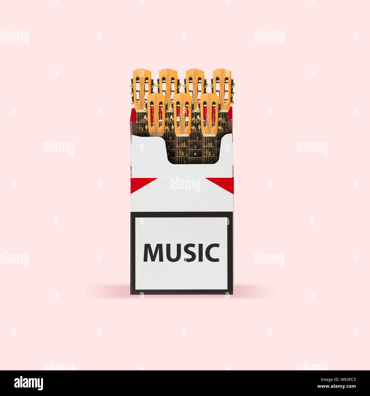 Abusing music. Guitars' headstocks as a cigarettes on pink background. Negative space to insert your text. Modern design. Contemporary art. Creative conceptual and colorful collage. Stock Photo