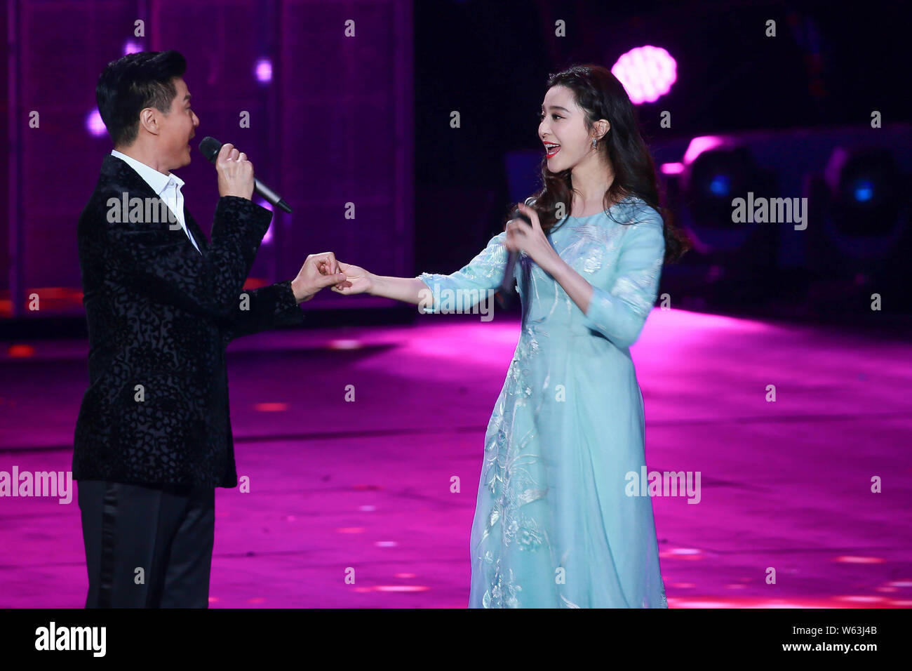 Chinese actress Fan Bingbing, right, and his father Fan Tao perform during  a filming session for the Chinese New Year gala of Beijing TV (BTV) in Beij  Stock Photo - Alamy
