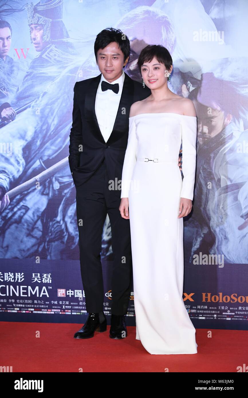 Chinese actress Sun Li, right, and her actor husband Deng Chao arrive ...