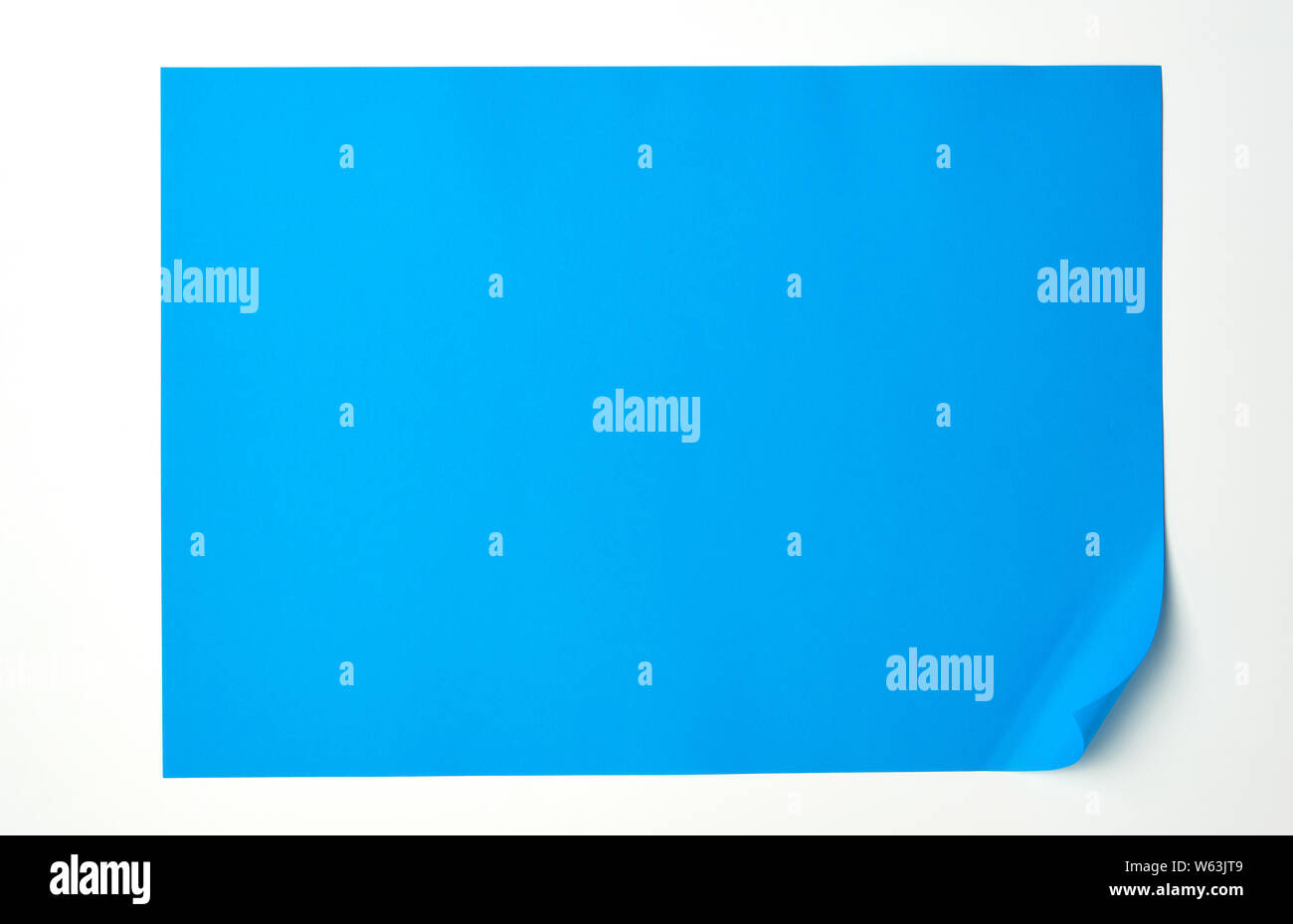 empty blue sheet of paper with a rounded corner on a white background
