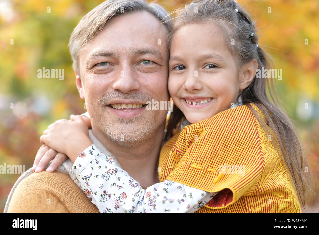 Portrait of father and cute daughter having fun outdoors Stock Photo