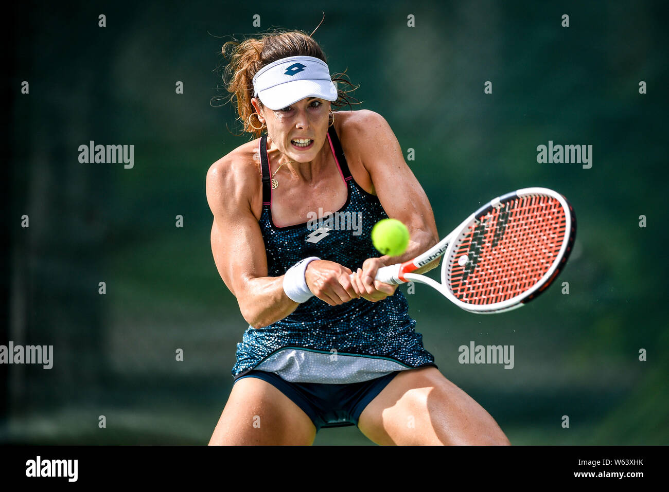 Alize Cornet of France returns a shot to Jennifer Brady of the United  States in their first round match during the WTA Guangzhou International  Women's Stock Photo - Alamy