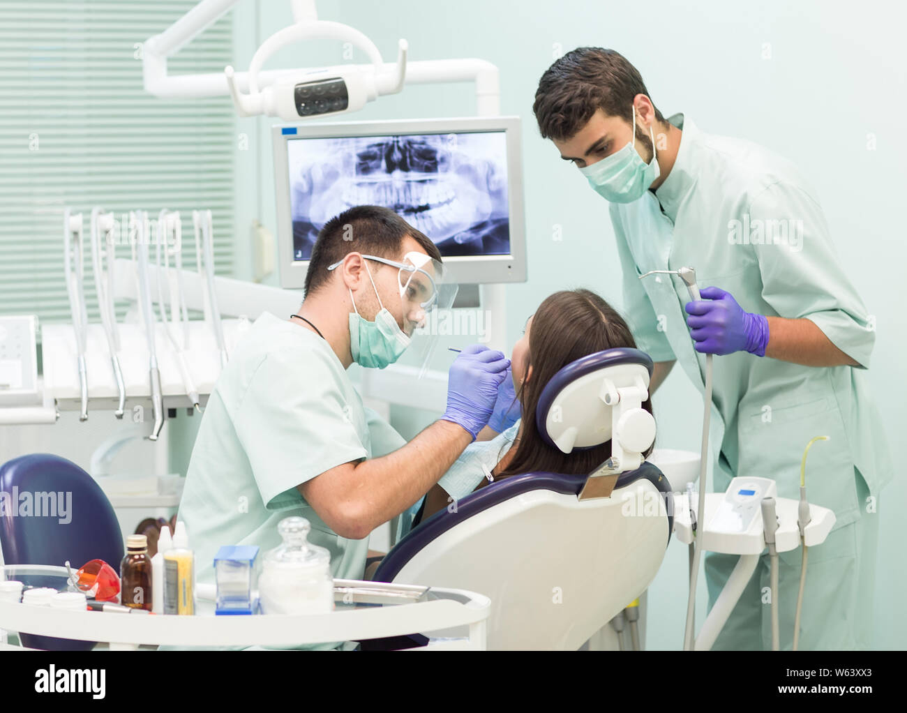 Doctor Dentist with an assistant work in a dental clinic Stock Photo