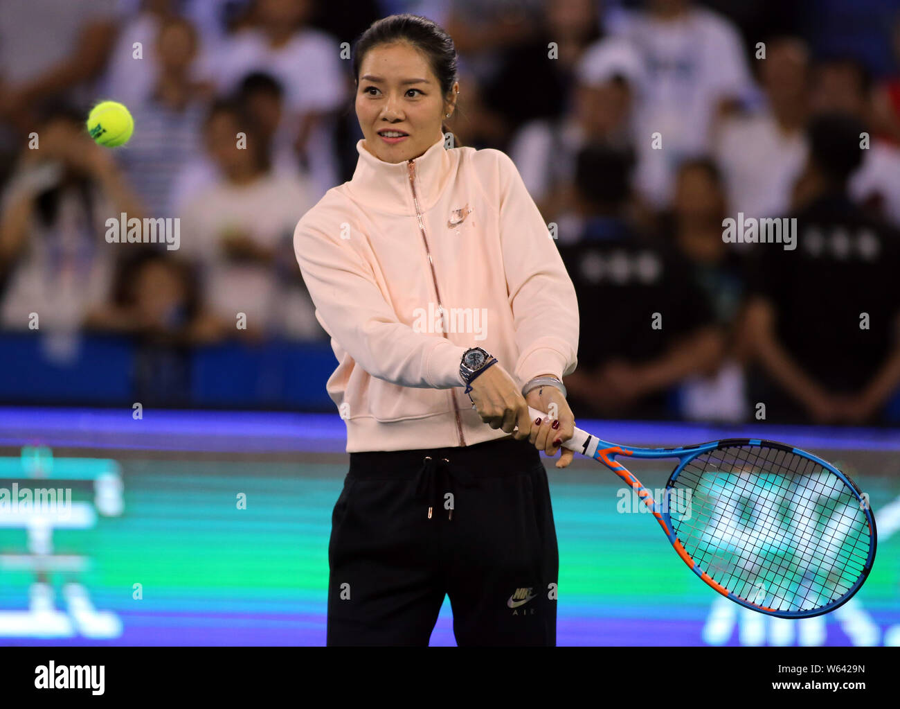 Retired Chinese tennis star Li Na is pictured at a first round match