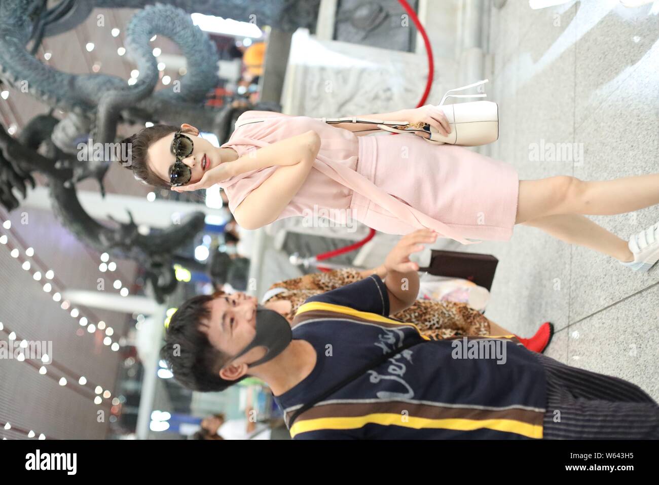 Chinese Uigur actress Gulnezer Bextiyar, also known as Gulnazar or Guli Nazha (Gulinazha), arrives at the Beijing Capital International Airport before Stock Photo