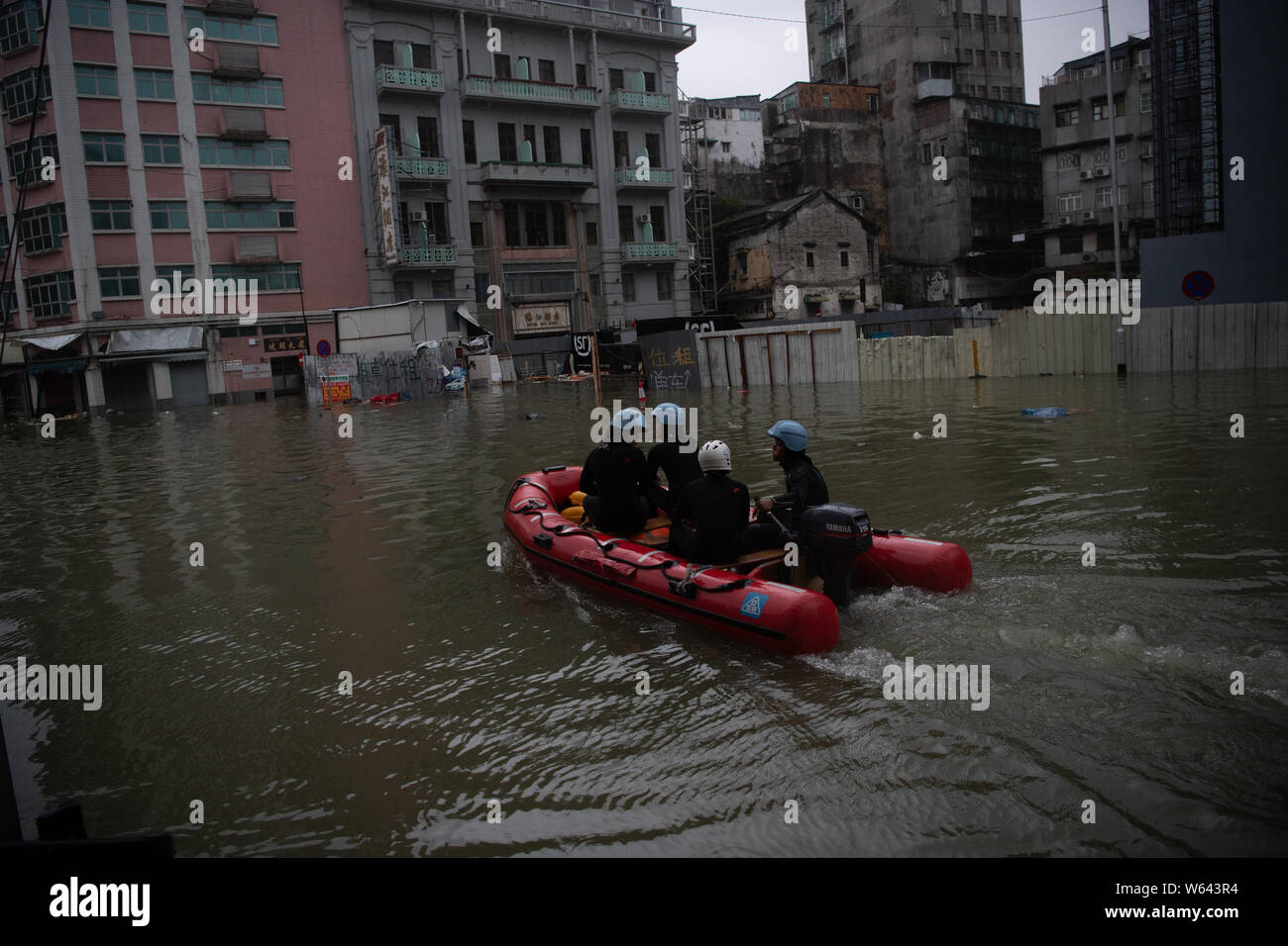 Rescuers evacuate local residents by inflatable life boat from flooded ...