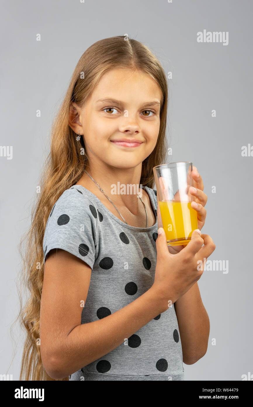 Happy girl long hair holds hi-res stock photography and images - Alamy