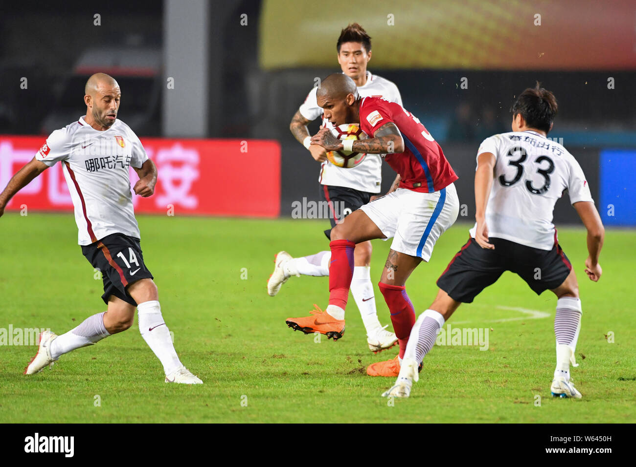 Heibi Rohrturen Brazilian football player Fernando Karanga of Henan Jianye, center ...