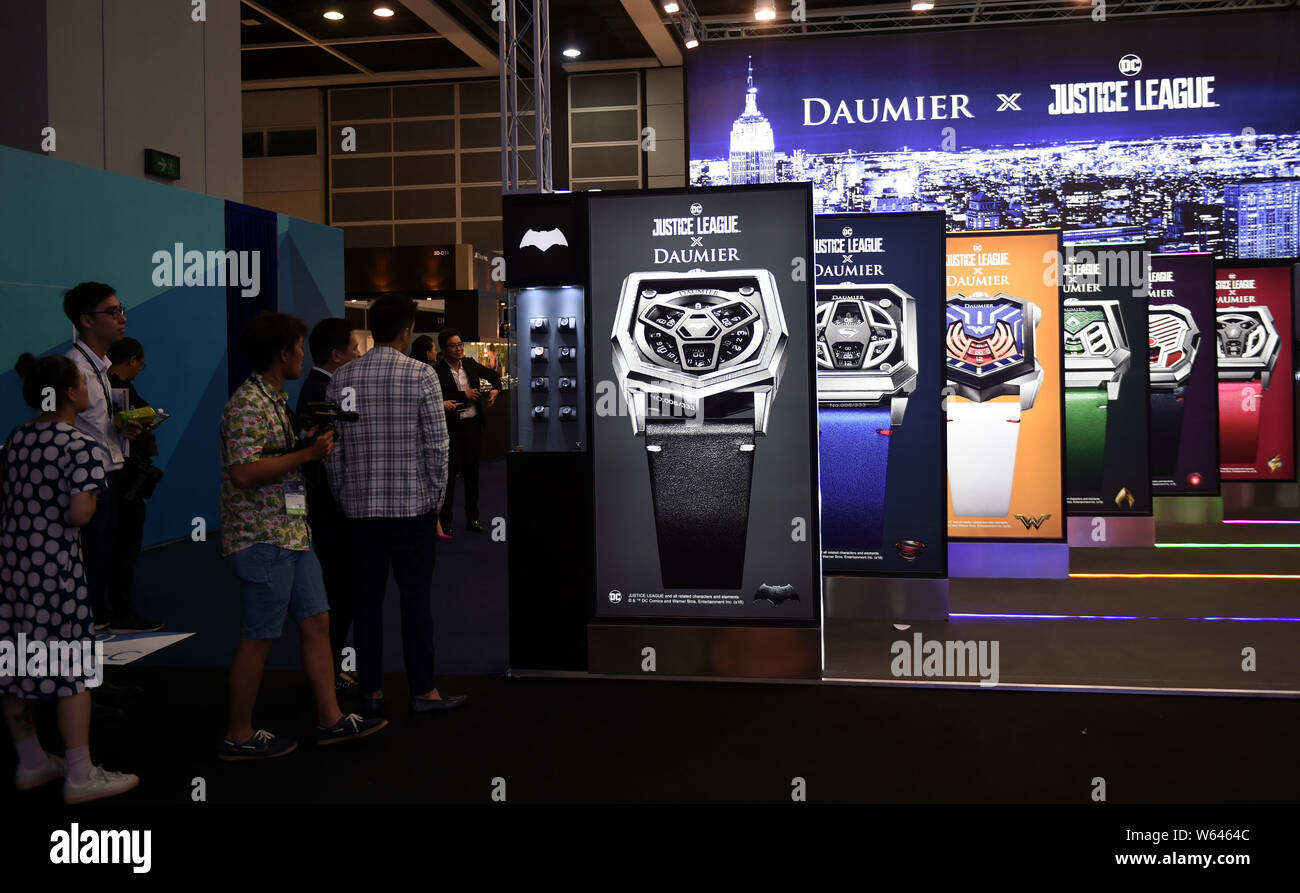 Visitors view Justice League x Daumier watches on display during the