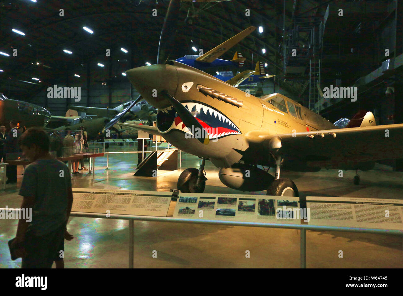 Beijing, USA. 24th July, 2019. People view the Curtiss P-40E Warhawk used by the Flying Tigers in the World War II Gallery of the National Museum of the U.S. Air Force in Dayton, Ohio, the United States, on July 24, 2019. The Flying Tigers, a U.S. air squadron composed of pilots from the United States Army Air Corps, Navy, and Marine Corps, helped the Chinese fight Japanese invaders in World War II. Credit: Zhang Fengguo/Xinhua/Alamy Live News Stock Photo