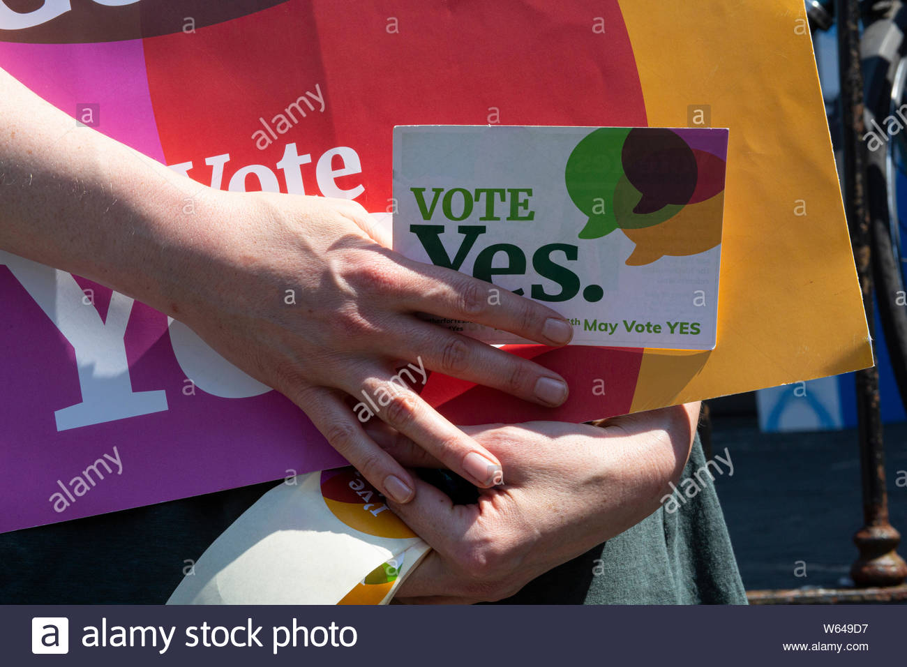 A woman holds a Yes card in her hands during the abortion campaign in ireland in 2018 Stock Photo