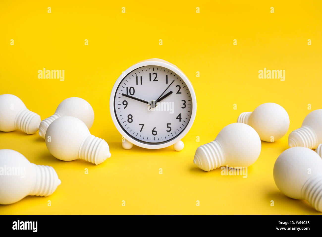 Time,dateline and creativity concepts with group of lightbulb and clock on pastel color background.Business solution.Performance of human.minimal styl Stock Photo