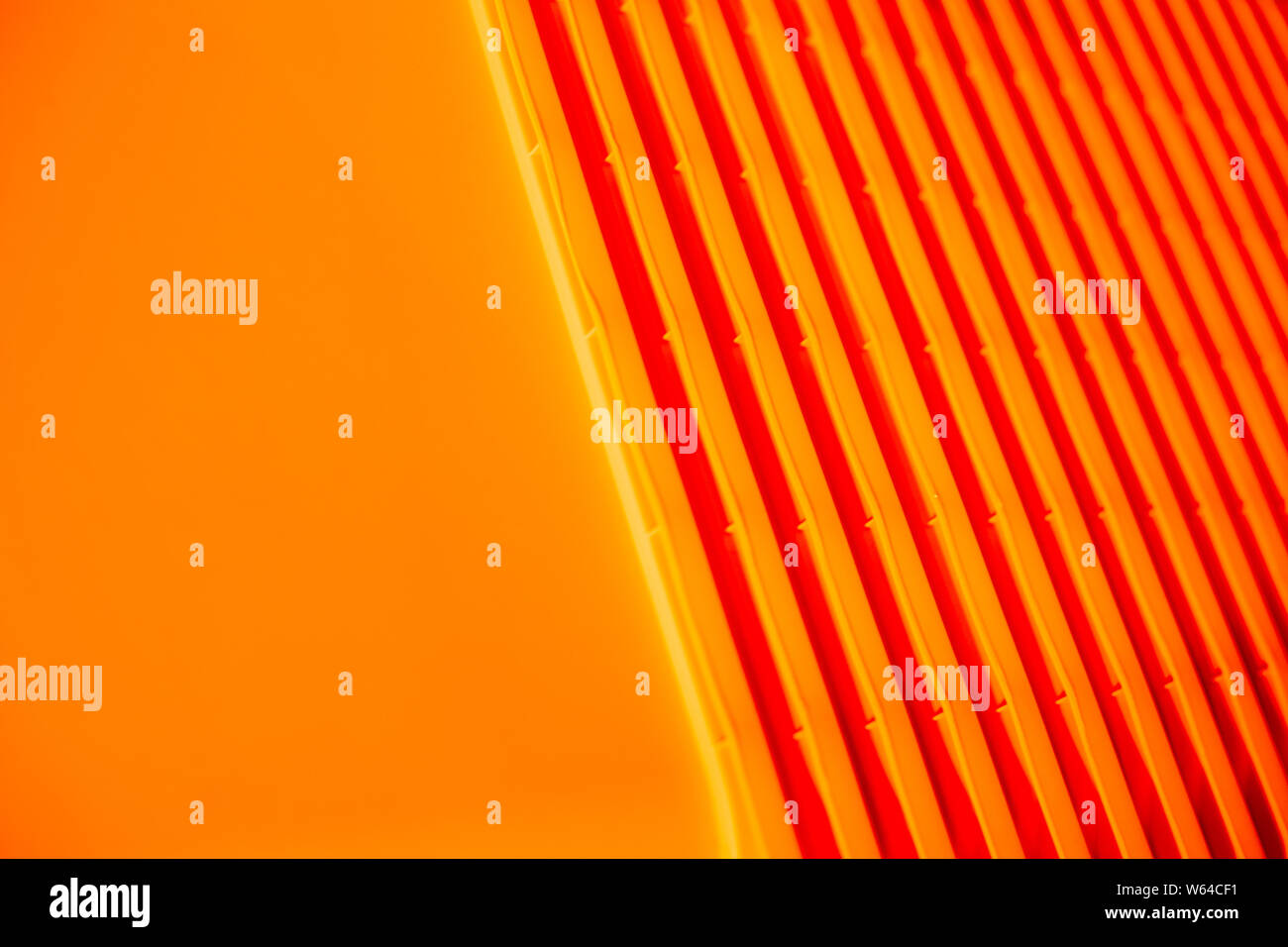 Orange background. plastic bag. Waste recycling concept. Environmental Protection. Polyethylene background texture.plastic containers stack . Concept Stock Photo
