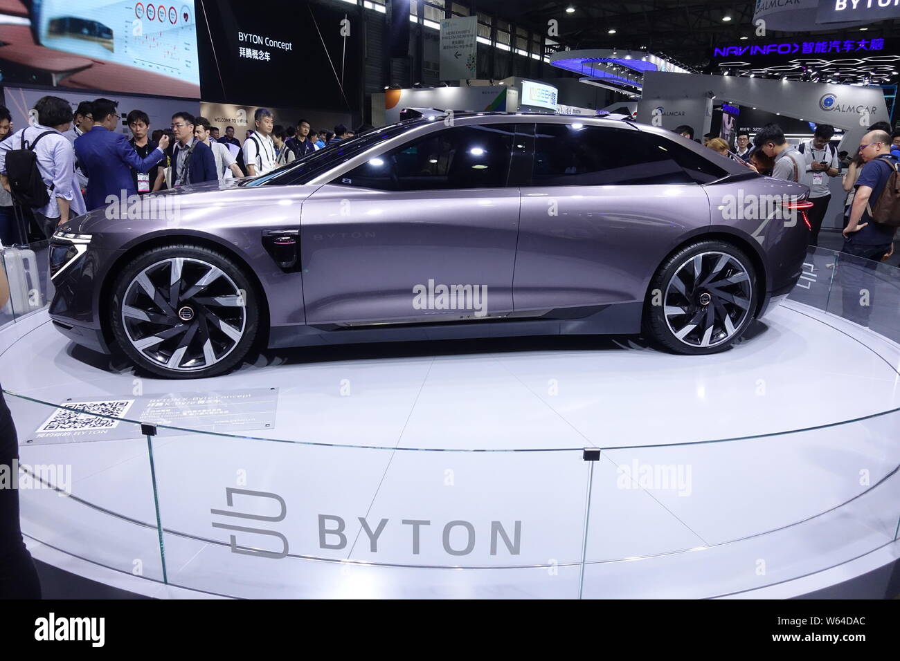 FILE People visit the stand of Byton during an exhibition in