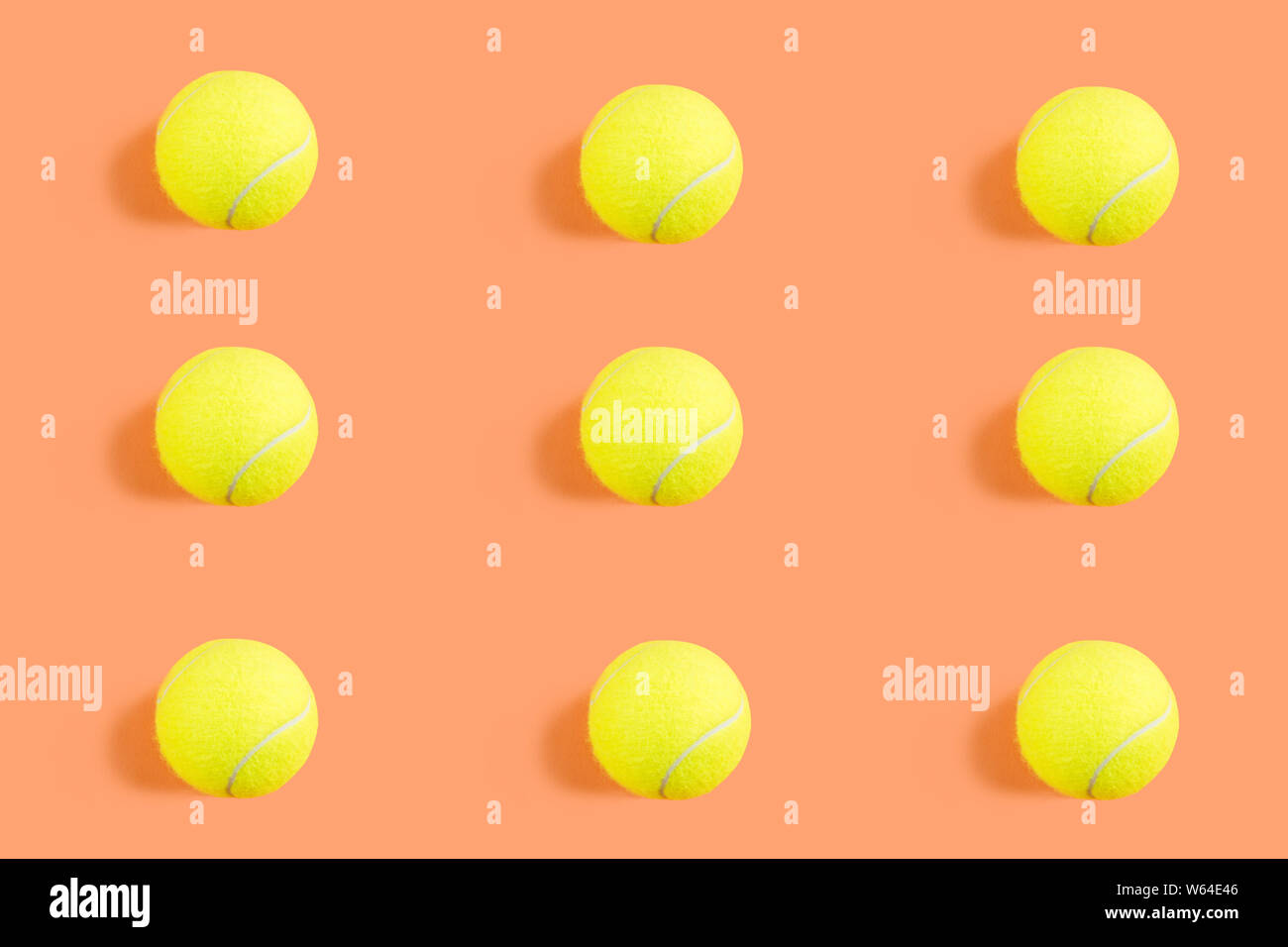 Tennis ball pattern on orange coral abstract background. Game, practise