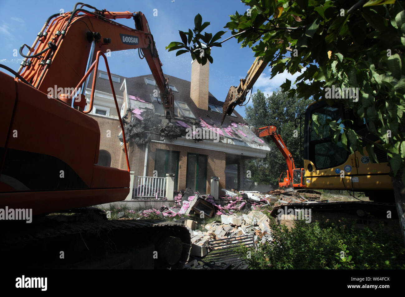 Chinese Workers Operate Excavators To Demolish Illegally Built Villas In Xian City Northwest