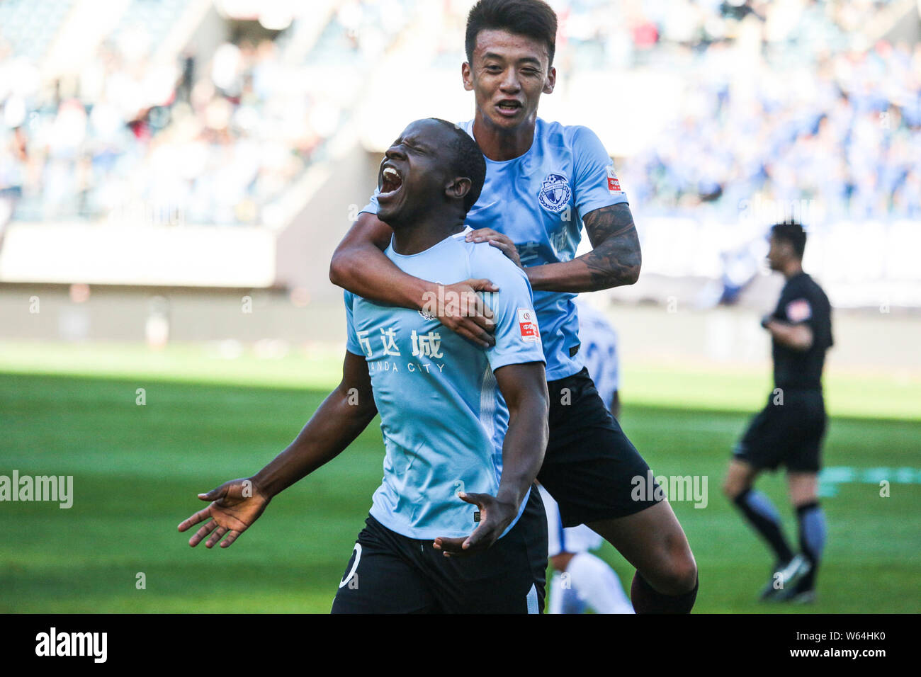 Zimbabwean football player Nyasha Mushekwi of Dalian Yifang celebrates