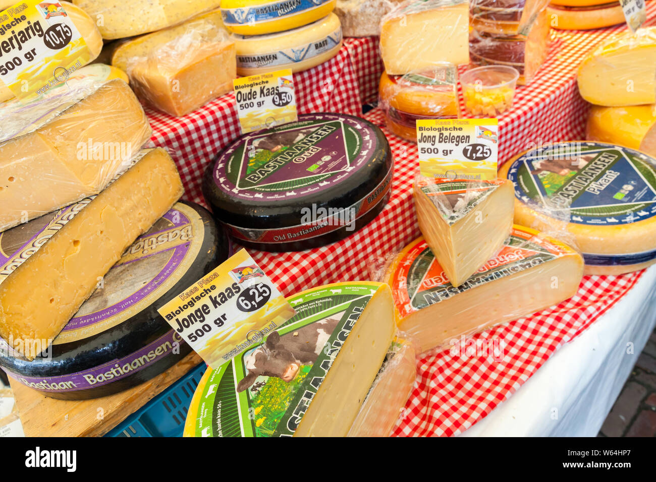 Amsterdam, Netherlands - February 25, 2017: Dutch cheese assortment is on a counter. Goods of Noordermarkt, Amsterdam Stock Photo