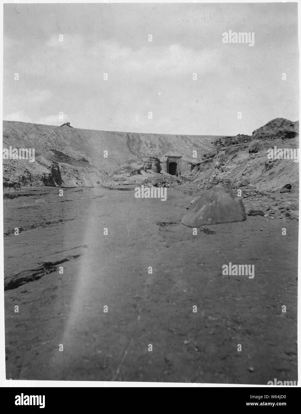 Culvert, BoA&P Railway, Missoula Gulch; Scope and content:  From Hugh Magone v. Colorado Smelting and Refinig Co., et.al. Magone sued for damaged because the piles of tailings from the ore concentrator and smelter operated by Anaconda poluted the waters of the Deer Lodge River and his farm in Deer Lodge Valley. Citing the economic benefit of the mines and smelters to the region the Master of the Chancery said the plaintiff ought to have known the water was polluted and refused to award monetary damages. Stock Photo