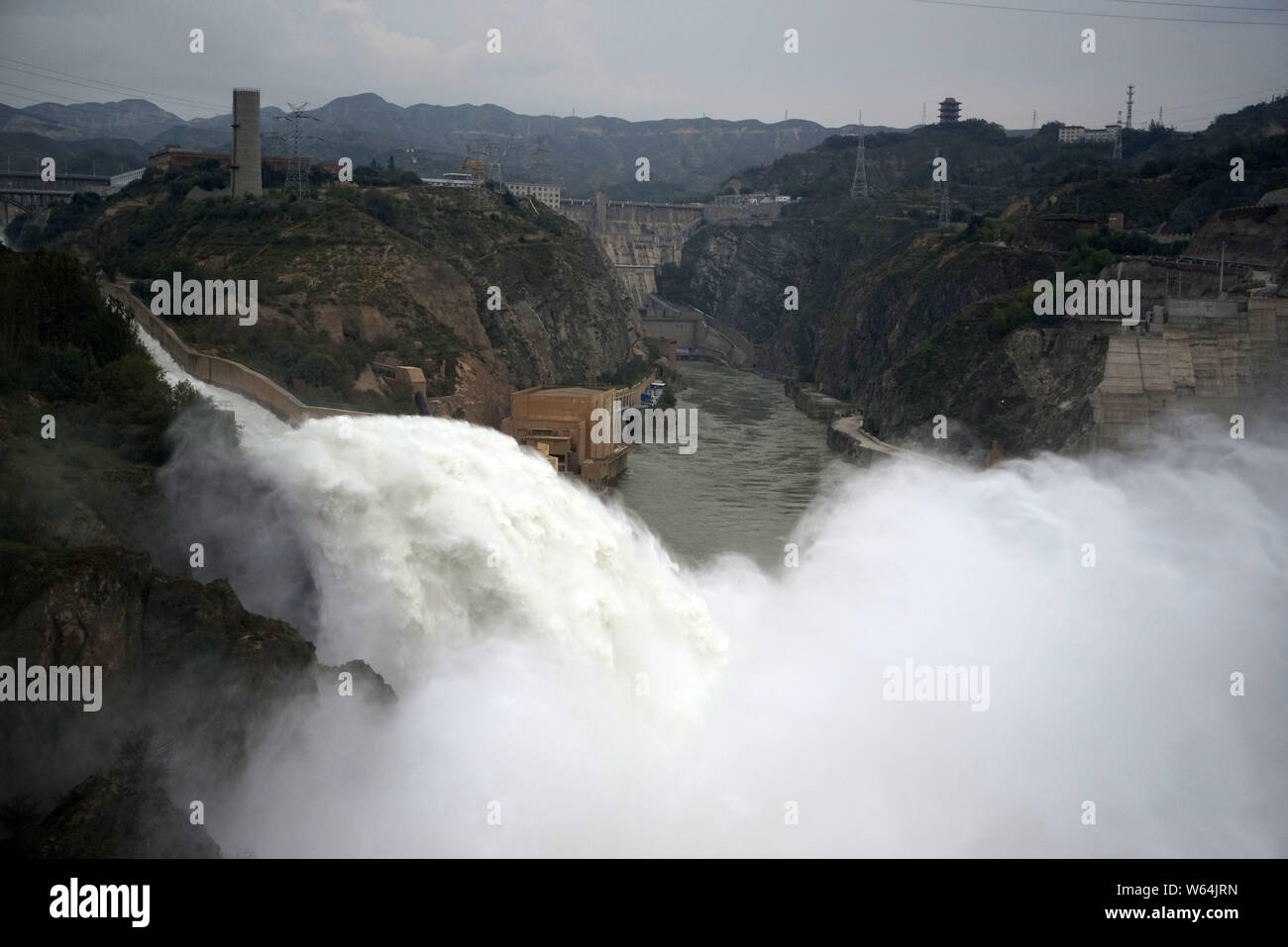 Water gushes out from the Liujiaxia Hydroelectric Station for flood control on the Yellow River in Yongjing county, Linxia Hui Autonomous Prefecture, Stock Photo