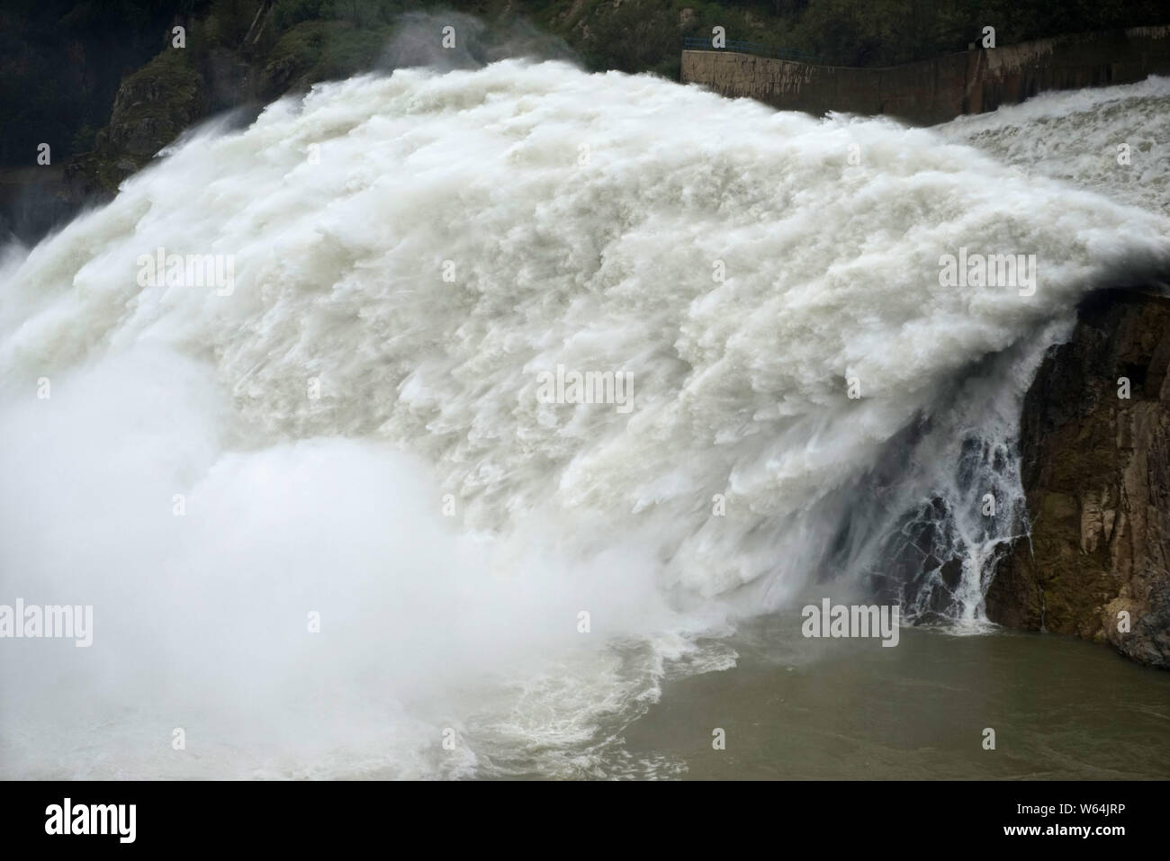 Water gushes out from the Liujiaxia Hydroelectric Station for flood control on the Yellow River in Yongjing county, Linxia Hui Autonomous Prefecture, Stock Photo