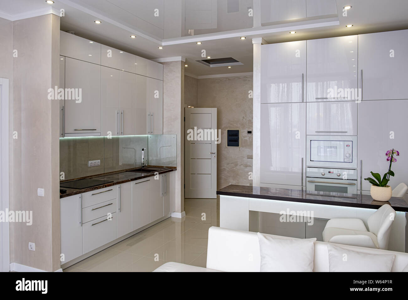 Interior of White modern kitchen in a house with a beautiful design ...