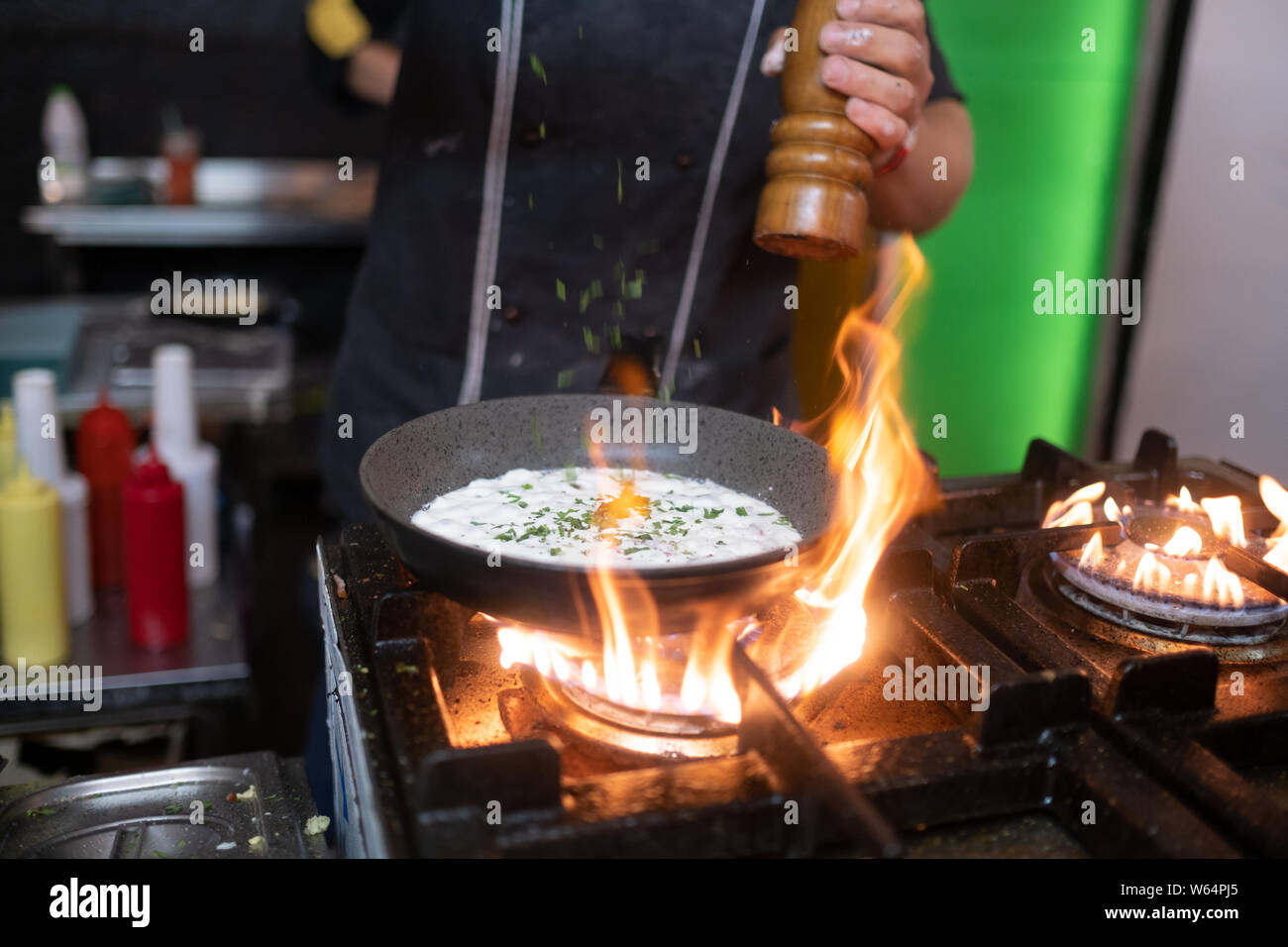 cooking the Omelette in a pan and gas stove. street food. cook
