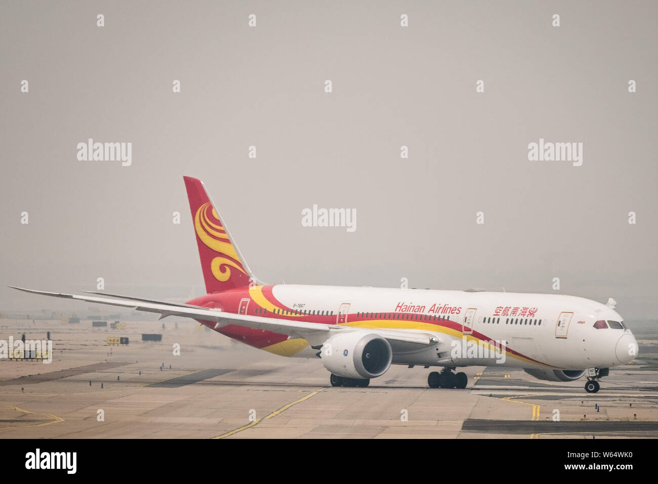 FILE--A jet plane of Hainan Airlines of HNA Group taxis at the Beijing  Capital International Airport in Beijing, China, 26 May 2018. With the land  Stock Photo - Alamy
