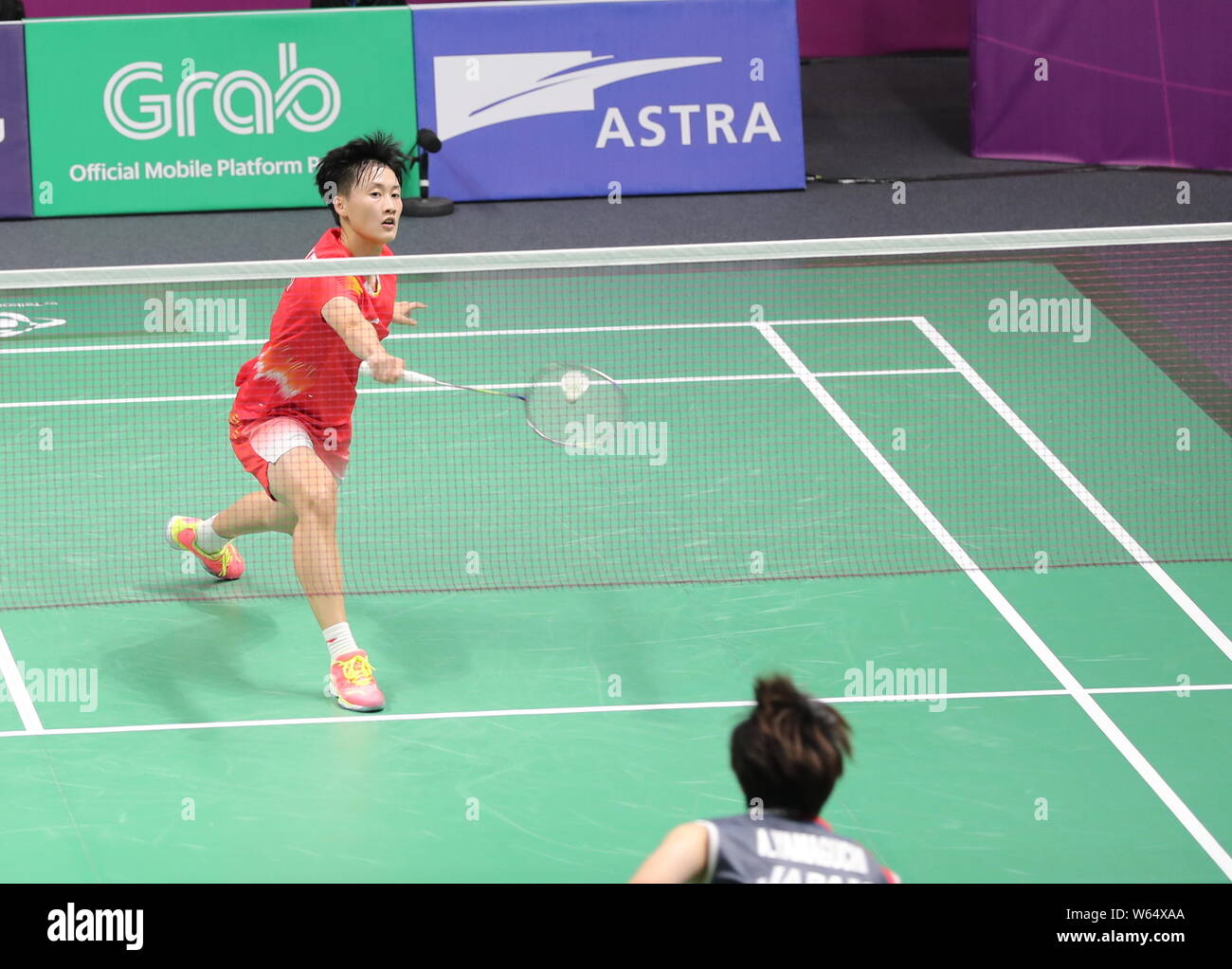 Chen yufei of china returns a shot to akane yamaguchi of japan in their womens single badminton quarterfinal match during the Chen yufei of china returns a shot to akane yamaguchi of japan in their womens single badminton quarterfinal match during the