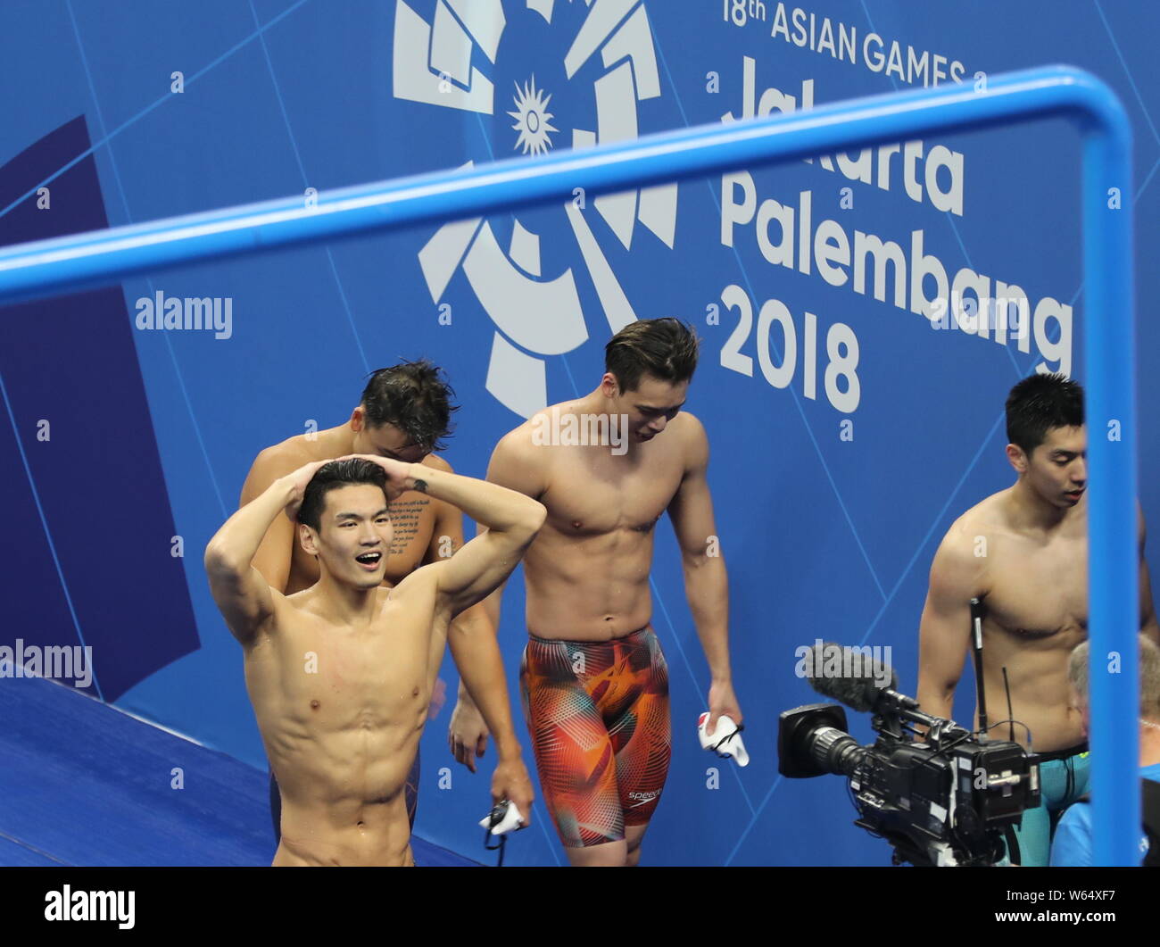 Chinese swimmers celebrate after winning the men's 4x100 medley relay swimming final during the 2018 Asian Games, officially known as the 18th Asian G Stock Photo