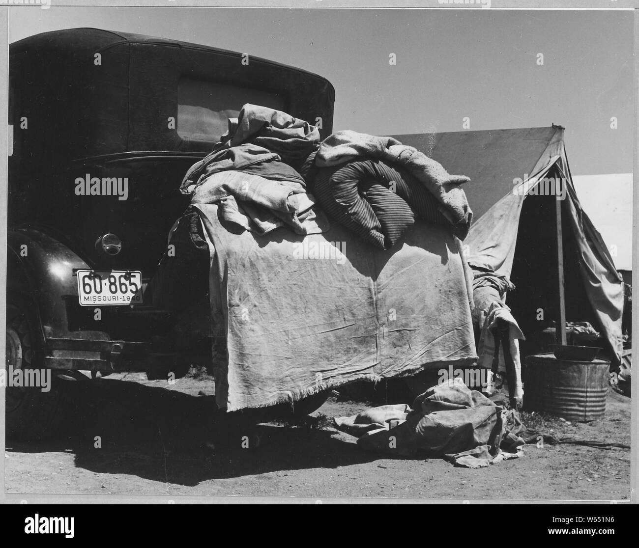 Edison, Kern County, California. Close-up of potato pickers camp. $6 per month is charged for the ri . . .; Scope and content:  Full caption reads as follows: Edison, Kern County, California. Close-up of potato pickers camp. $6 per month is charged for the right to pitch a tent on the ground. Stock Photo