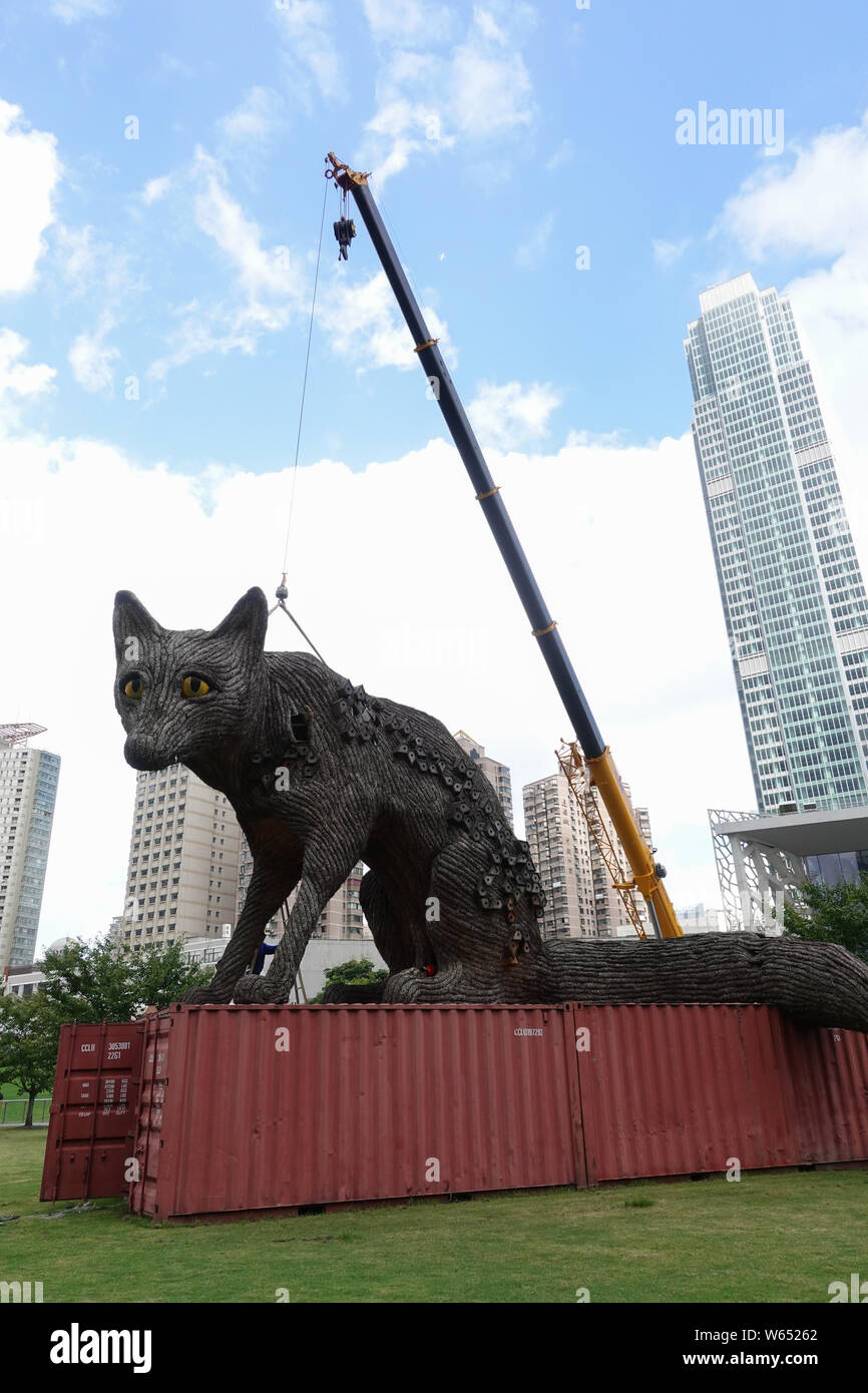 The 7-meter- high and 10-meter-long metal-and-straw sculpture 'Urban Fox' is being dismantled at Jing'an Sculpture Park in Shanghai, China, 15 August Stock Photo