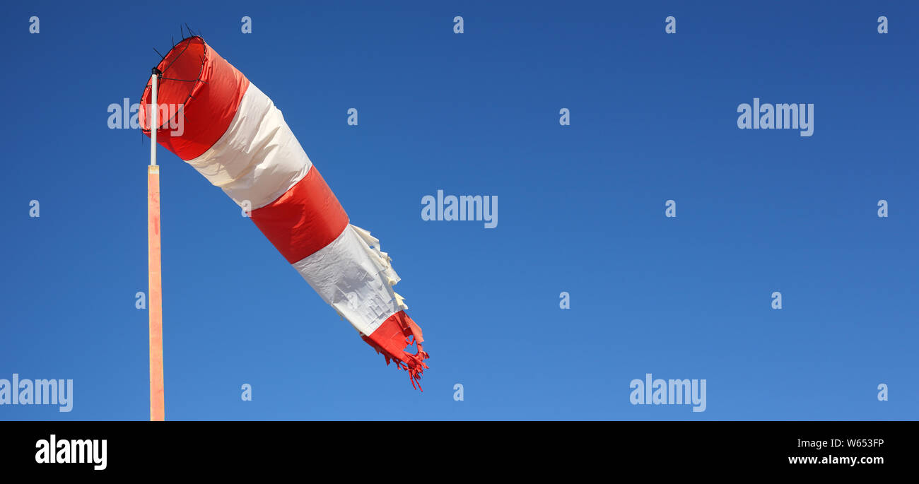 Boats parking and aircraft Wind direction indicator. Windsock the sky