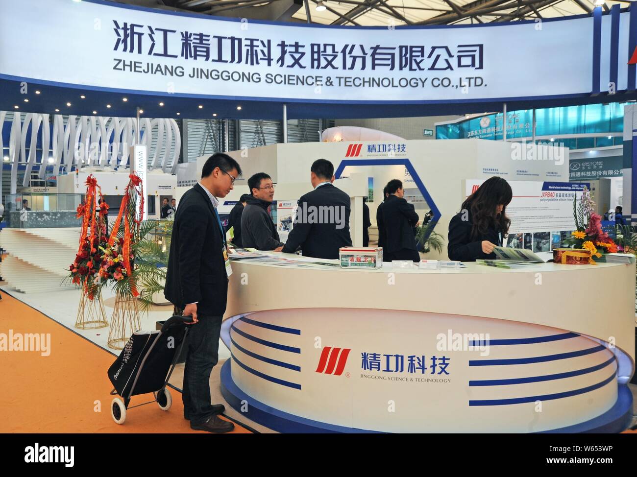 FILEPeople visit the stand of Zhejiang Jinggong Science