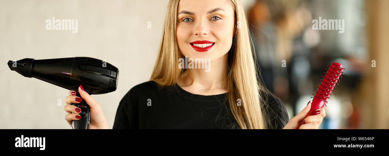 Making hairstyle using hair dryer hi-res stock photography and images ...