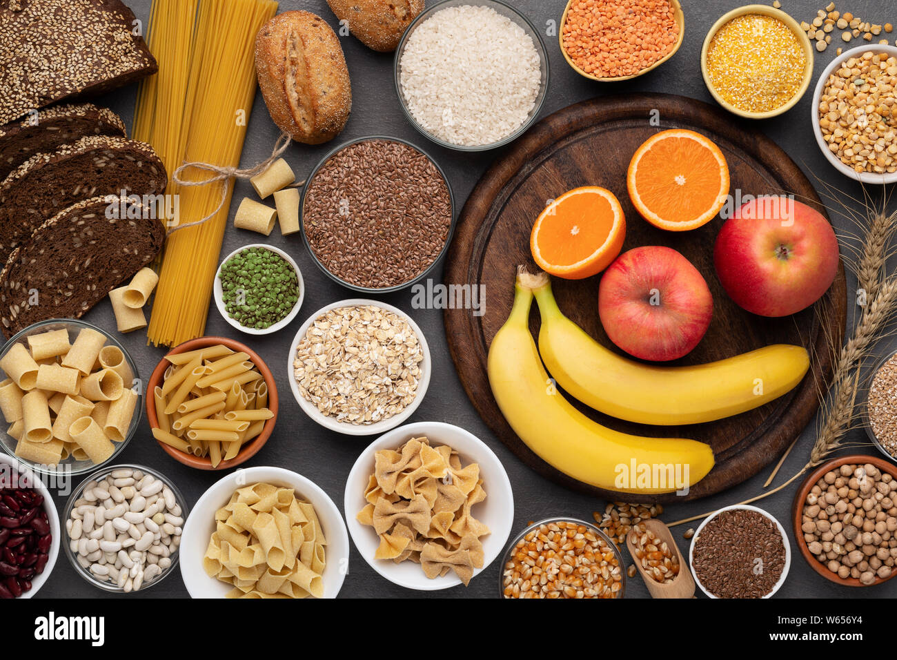 Gluten free grains, bread, pasta and fruits on wood Stock Photo