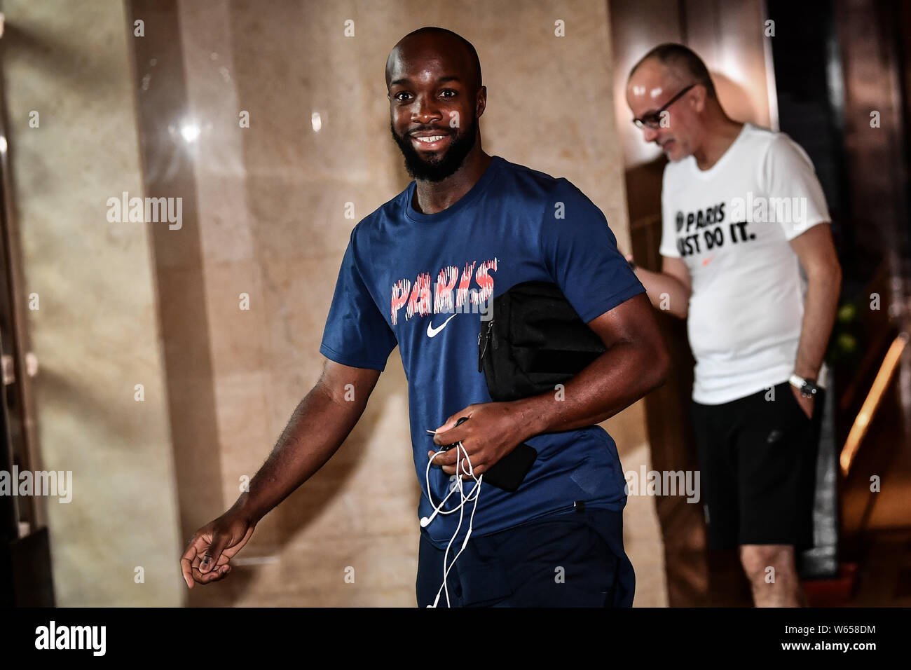 Lassana Diarra and teammate of Paris Saint-Germain leave the hotel for an event for Trophee des Champions 2018 in Shenzhen city, south China's Guangdo Stock Photo