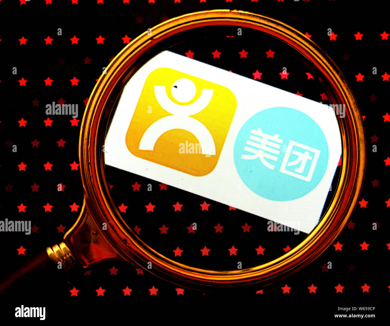 --FILE--A Chinese netizen looks the logos of online group buying site ...