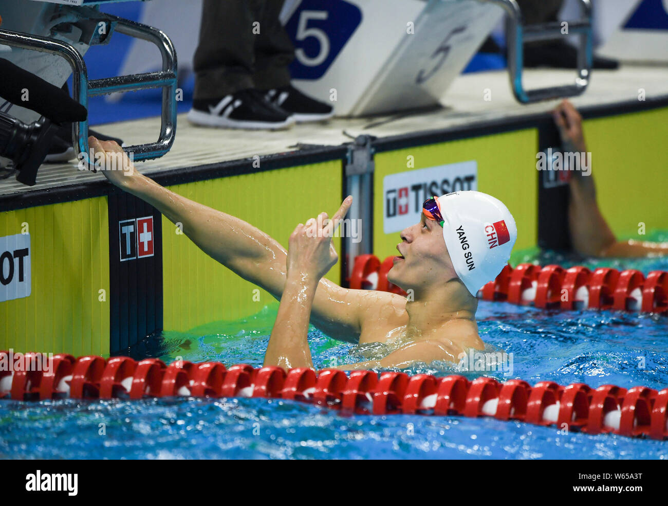 Sun Yang of China celebrates after winning the men's 200m freestyle